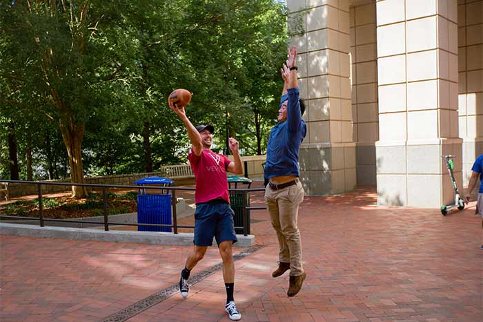 two people playing with a football